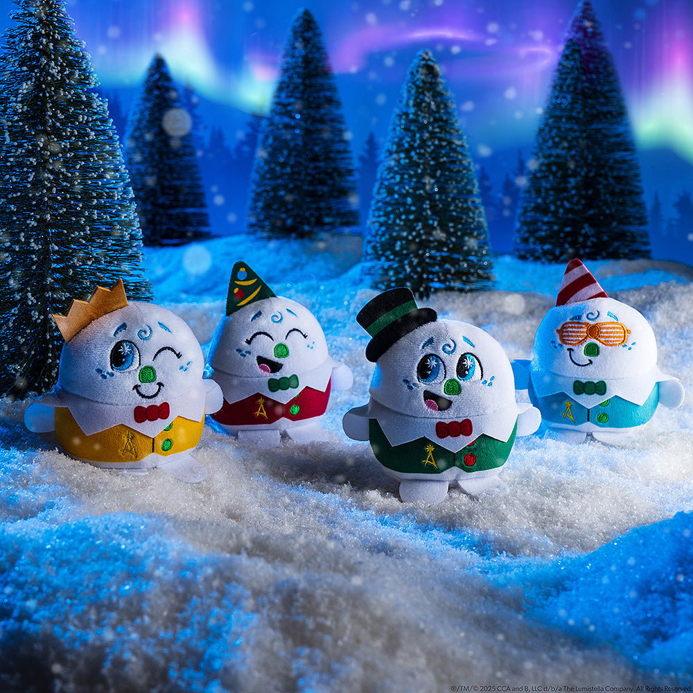 All four playable plush celebration snowmen pictured in a snowy environment with the Northern Lights overhead. These pint-sized North Pole pals are stirring up a celebration for the 20th year of The Elf on the Shelf®! Collect all four and celebrate the season!