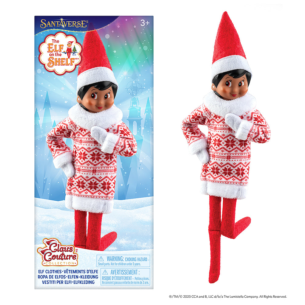 The front packaging of the Claus Couture Collection® Snowflake Sweetie Dress with a girl Scout Elf sporting the dress to the left of the packaging