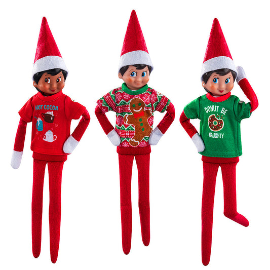 A trio of Scout Elves, each sporting a t-shirt from the Claus Couture Collection® Festive Fun T-Shirt Set.