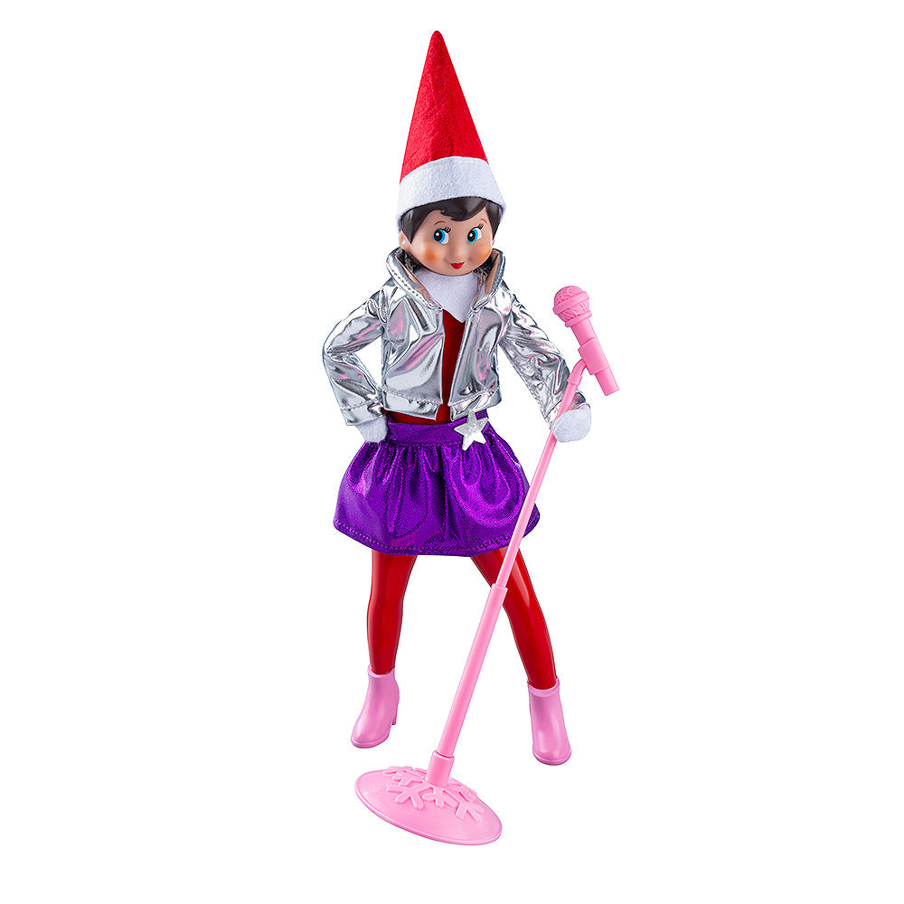 A girl Scout Elf staged with the MagiFreez® Pop Star pants, skirt, jacket and mic stand.