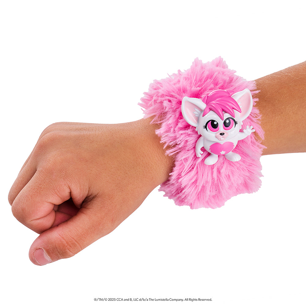 A close up of the pink Bogie™ Wrap-Alongs wrapped around a child's wrist