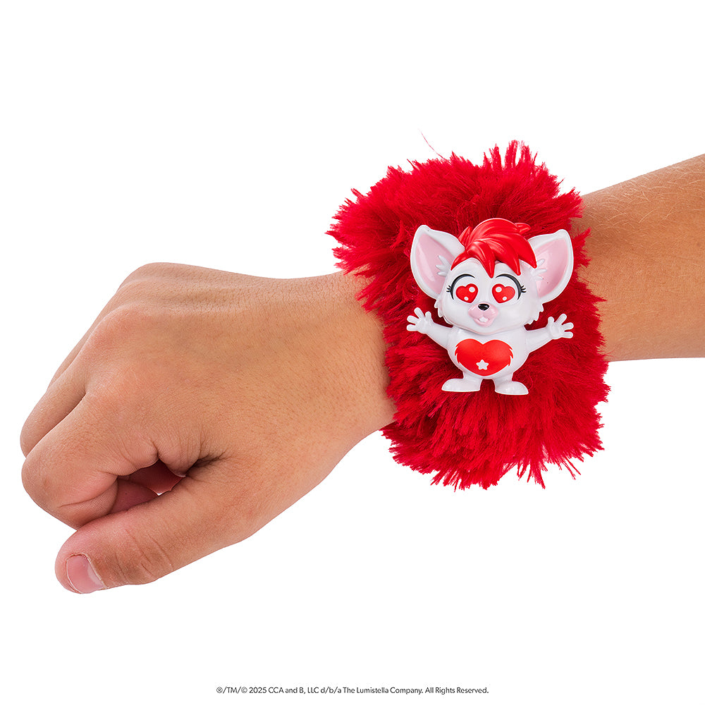 A close up of the red Bogie™ Wrap-Alongs wrapped around a child's wrist