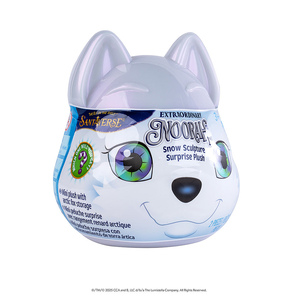 A tilted side-view of the front of packaging of the Noorah™ Snow Sculpture Surprise, which features Noorah's head as a plastic surprise container.