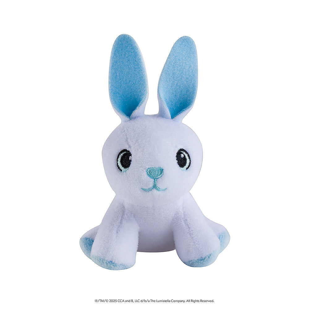 This image features the 1 of the 4 mini plush snow sculpture designs that you could get in the Noorah™ Snow Sculpture Surprise. This plush is a cute rabbit character in white and light blue.