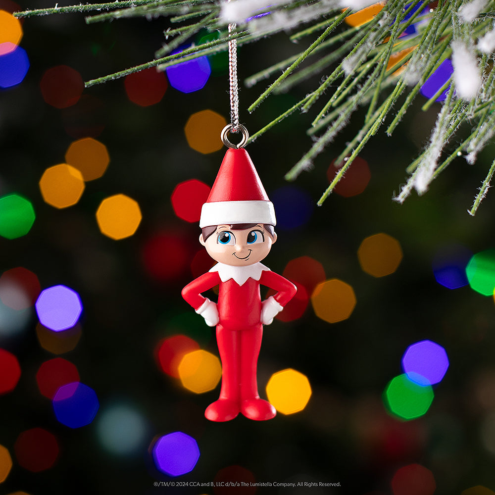 Scout Elf® ornament hanging from a Christmas tree