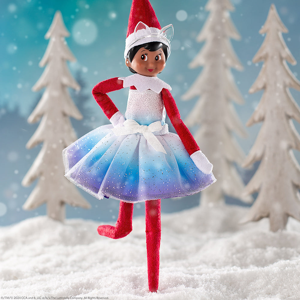 Scout Elf staged in a wintery wonderland sporting the Claus Couture Noorah Dress