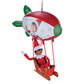 A girl Scout Elf® takes a ride in the Polar Props™ Peppermint Blimp, waving to those passing by.