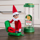 A Scout Elf packs his suitcase in preparation to go on a trip in his Scout Elf® Carrier, Ltd. 20th Anniversary Ed. Kit.