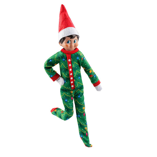 A boy Scout Elf poses in the
Claus Couture Collection® Goodnight, Sleep Bright PJs
