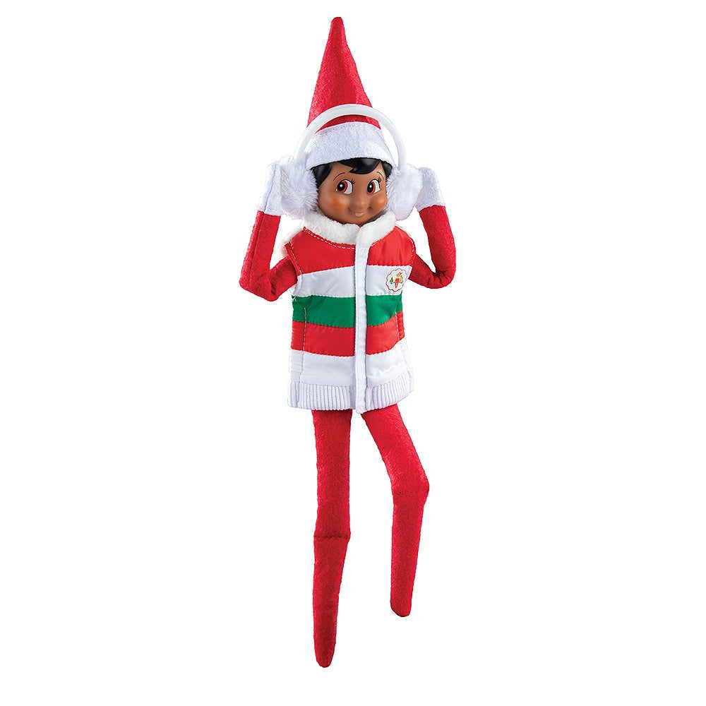 A Scout Elf® sporting the Claus Couture Collection® Bundle-Up Puffer Vest and earmuffs