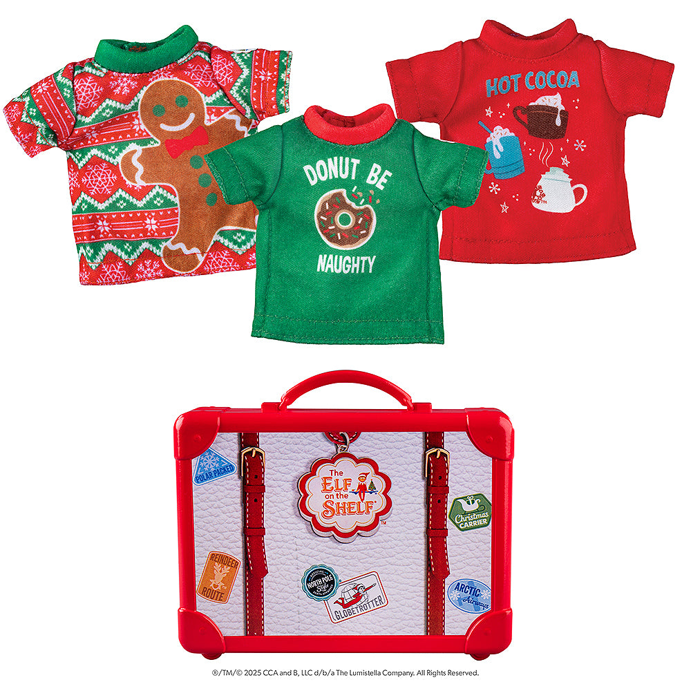 A flat lay view of the Claus Couture Collection® Festive Fun T-Shirt Set: a green tee with red collar with a donut graphic and the words, "Donut Be Naughty", a red tee with hot cocoa graphics and the words, "Hot Cocoa", and a green and red Fair Isle pattern with snowflakes and a large gingerbread man graphic. Also shown is the red and white plastic storage suitcase, adorned with passport stamps and stickers.