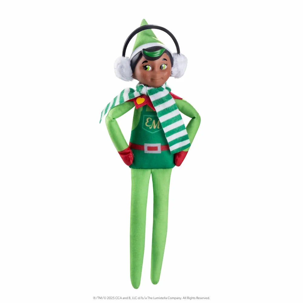 The Elf Mates® Cobbler with black hair, posed standing with his hands on his hips. He is wearing a set of earmuffs and a scarf.