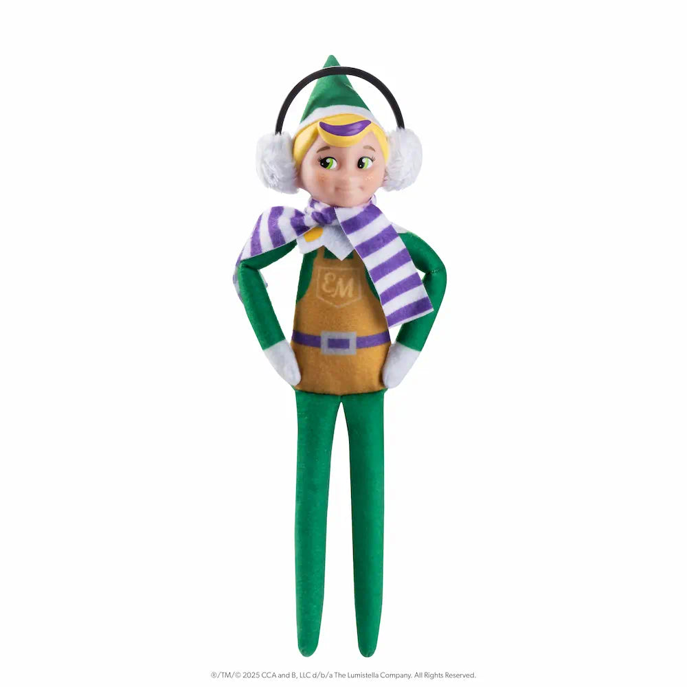 The Elf Mates® Toy Maker with blonde hair, posed standing with his hands on his hips. He is wearing a set of earmuffs and a scarf.