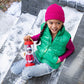 A little girl with her Scout Elf outdoors on vacation visiting family for the Christmas holidays. She is carrying her Scout Elf in a Scout Elf Carrier