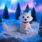 The Elf Pets® Arctic Fox plush in a wintery environment with an aurora sky, conifer trees and snow.