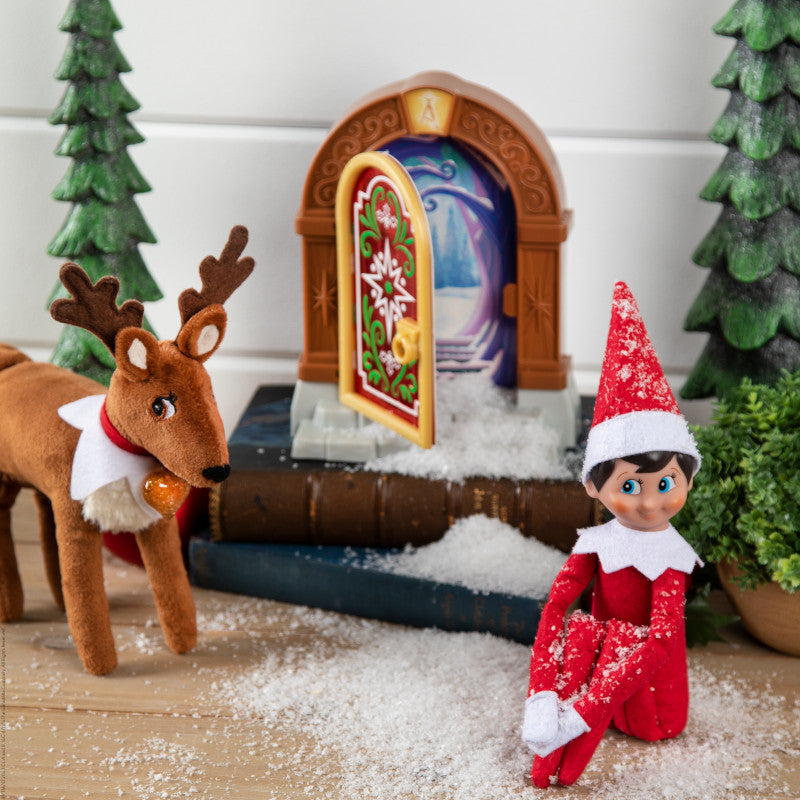 The Elf on the Shelf® Santaverse™  Elf Door - Boy Scout Elf and Reindeer Next To Open Door
