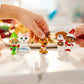 An up close shot of a child's hand playing with the Santaverse™ Minis (Series 5).