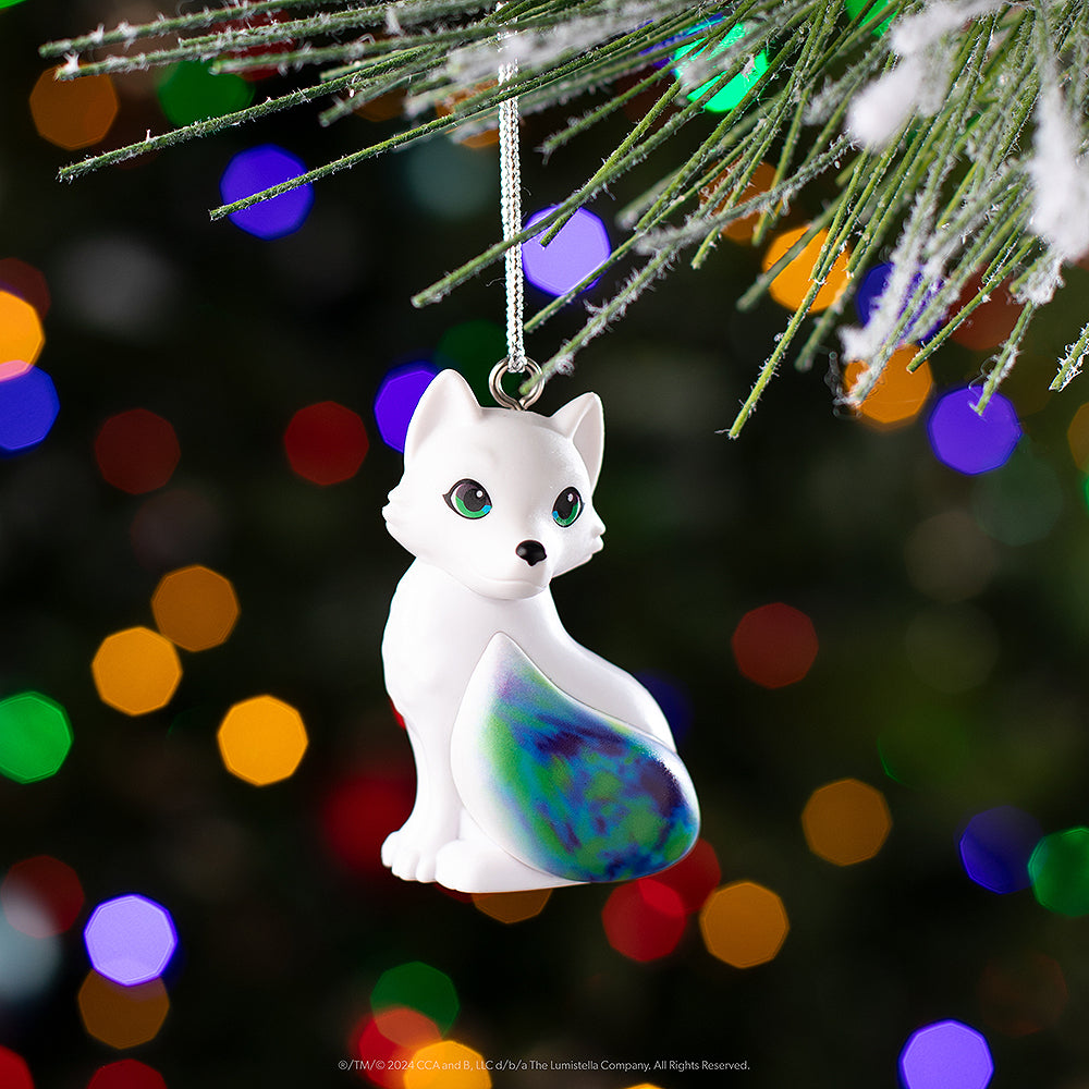 Noorah™ ornament hanging from a Christmas tree