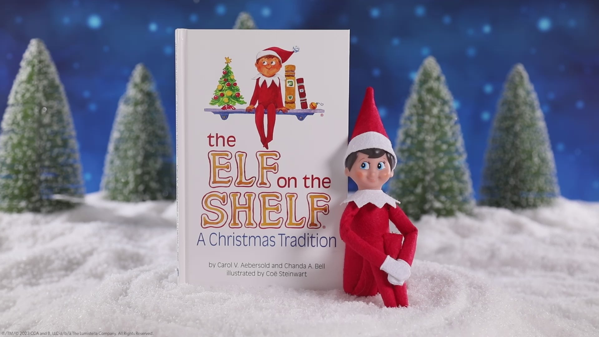 The Elf on the Shelf Tradition book with Scout Elf on a snowy forest, products rotating to show a 360 degree view