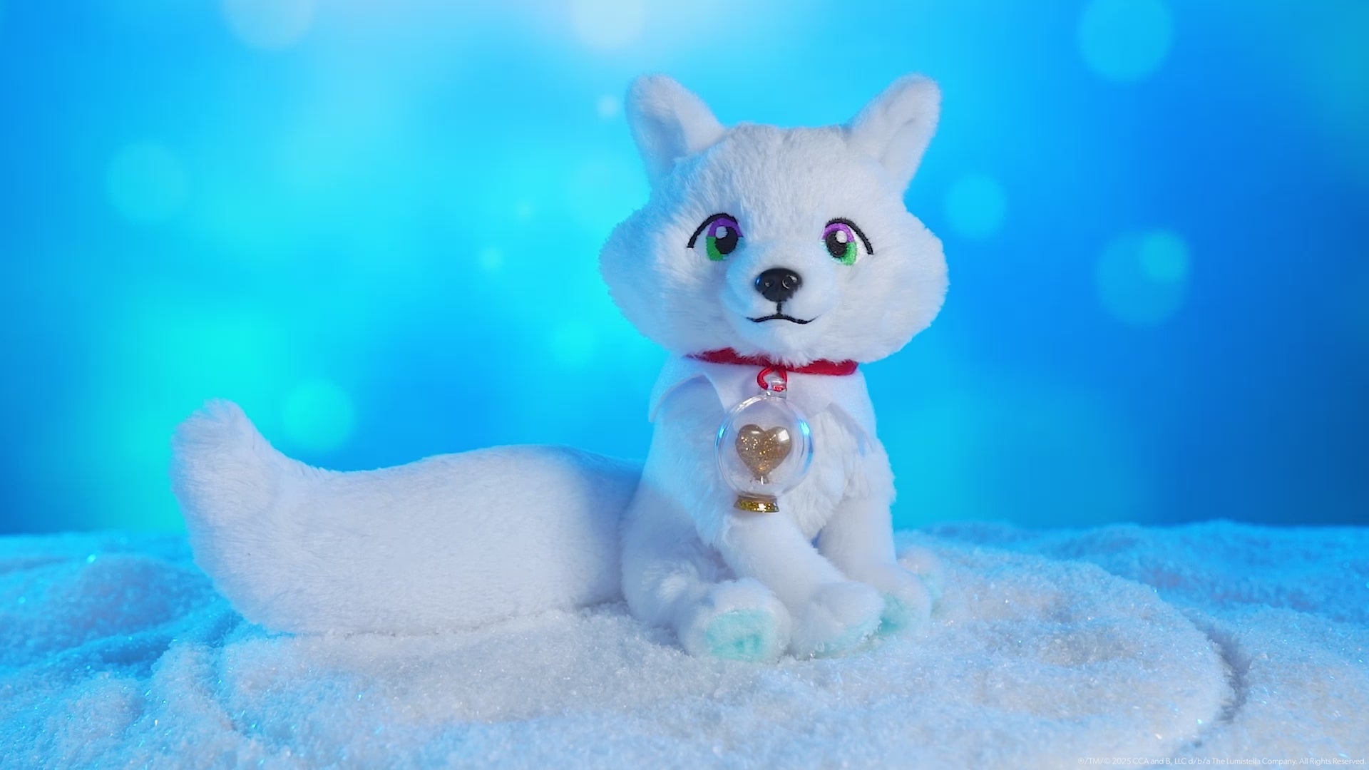 Product video of the Arctic Fox plush on a turntable spinning around in an arctic-themed environment with snow and a light blue, wintery background.
