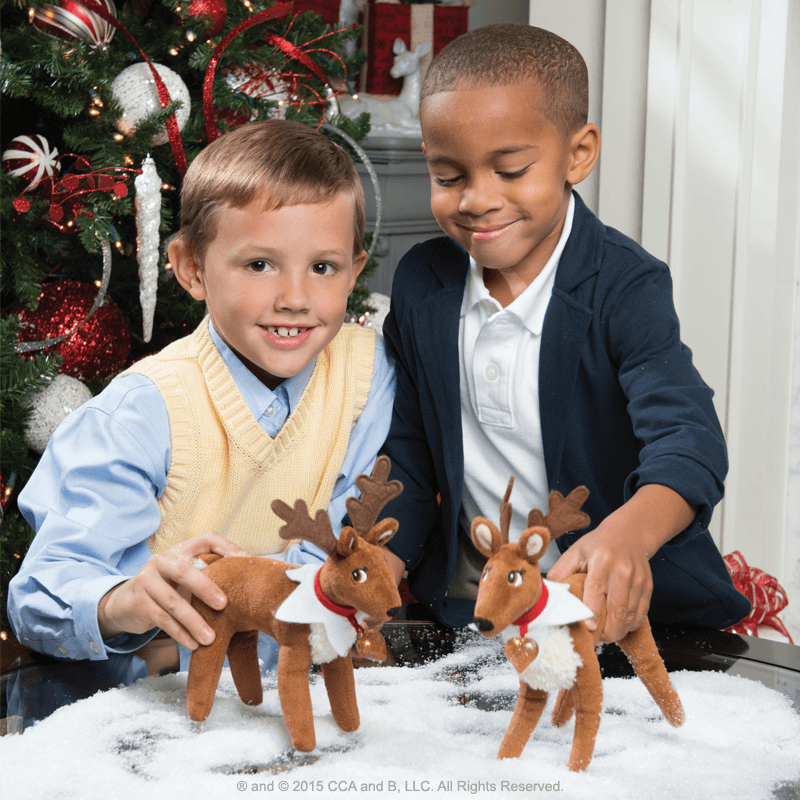 Kids playing with the Elf Pets®: A Reindeer Tradition